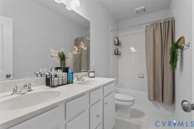 a bathroom with a sink vanity and a mirror