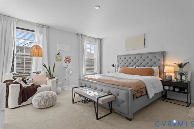 a bedroom with a bed and a television