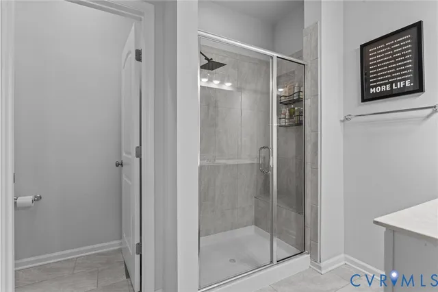 a en suite bathroom with a sink and a mirror