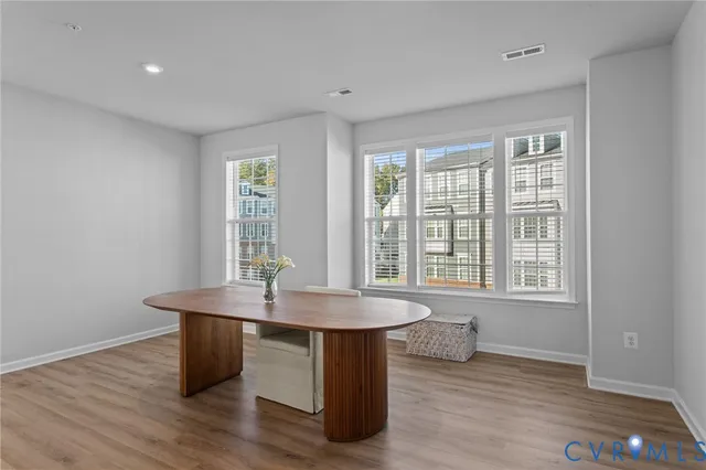 a room with furniture and wooden floor