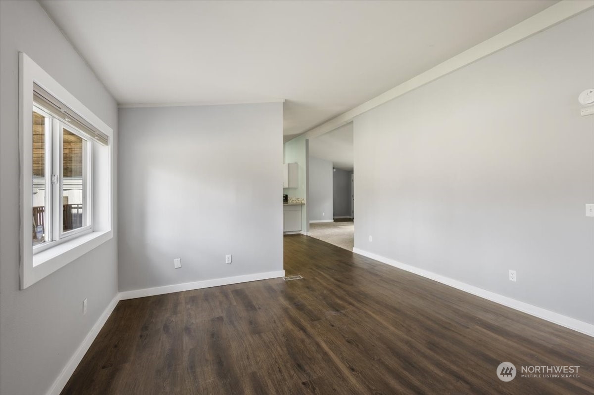 815 Carlson Road Snohomish, WA 98290 - Photo 12 of 21 a view of an empty room with wooden floor and a window
