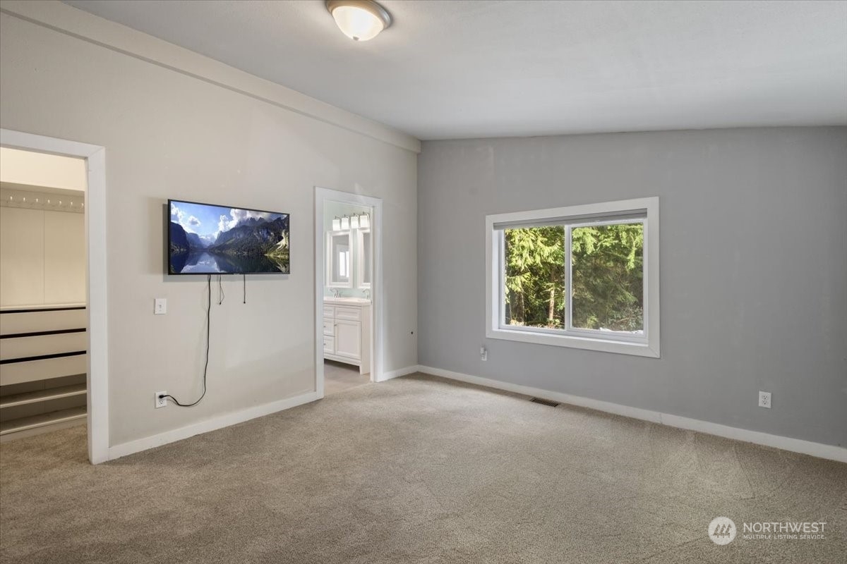 815 Carlson Road Snohomish, WA 98290 - Photo 14 of 21 an empty room with windows and closet