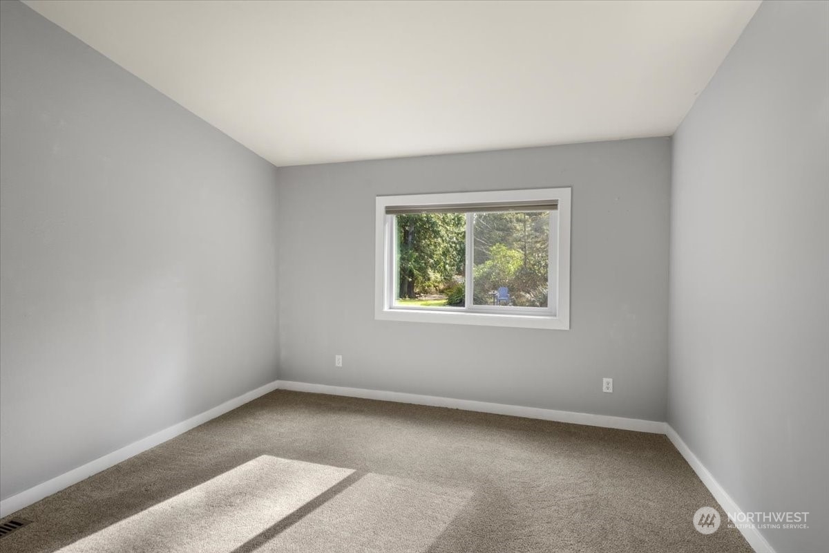 815 Carlson Road Snohomish, WA 98290 - Photo 18 of 21 an empty room with a window