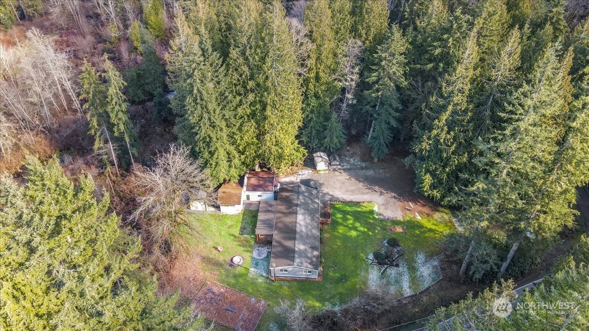 815 Carlson Road Snohomish, WA 98290 - Photo 4 of 21 a backyard of a house with outdoor seating and green space