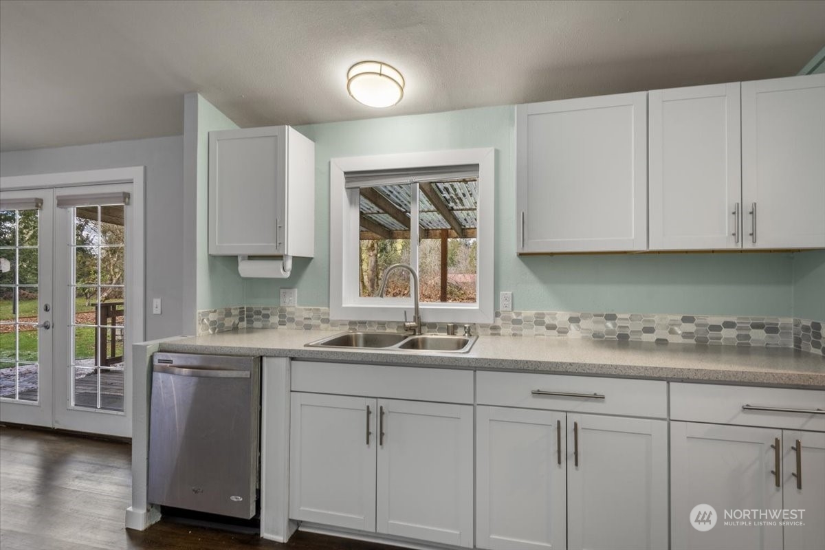 815 Carlson Road Snohomish, WA 98290 - Photo 7 of 21 a kitchen with a sink dishwasher and cabinets