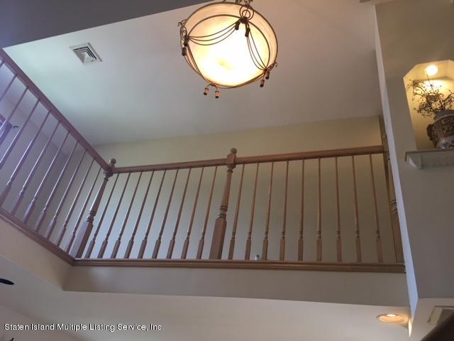 50 Beacon Place Staten Island, NY 10306 - Photo 11 of 28 a view of a hallway with wooden floor