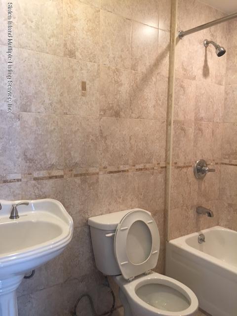 50 Beacon Place Staten Island, NY 10306 - Photo 20 of 28 a bathroom with a toilet a sink and bathtub