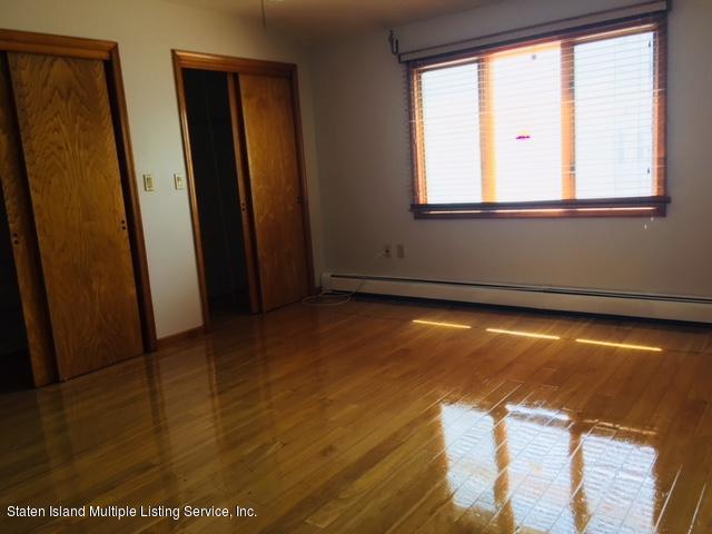 50 Beacon Place Staten Island, NY 10306 - Photo 24 of 28 a view of an empty room with wooden floor and a window