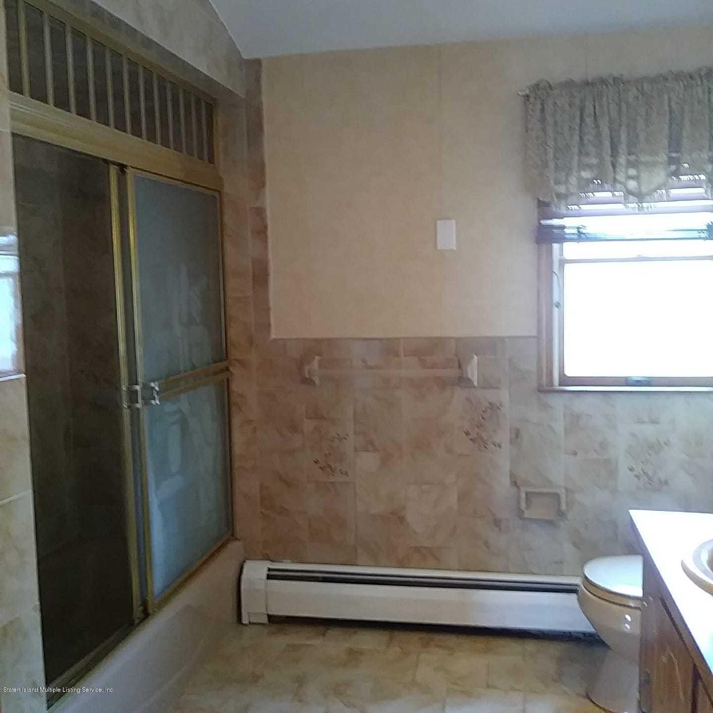 50 Beacon Place Staten Island, NY 10306 - Photo 26 of 28 a bathroom with a window