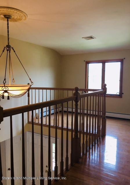 50 Beacon Place Staten Island, NY 10306 - Photo 27 of 28 a view of hallway with stairs and wooden floor