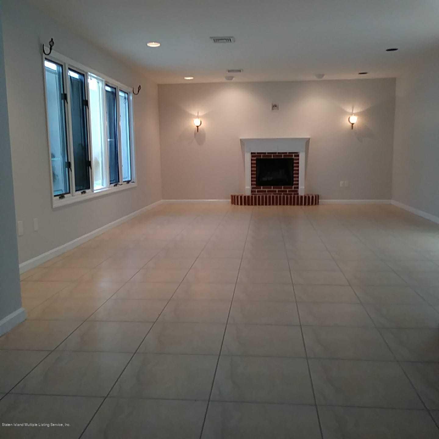 50 Beacon Place Staten Island, NY 10306 - Photo 8 of 28 a view of an empty room with a fireplace