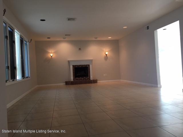 50 Beacon Place Staten Island, NY 10306 - Photo 9 of 28 a view of an empty room with a fireplace
