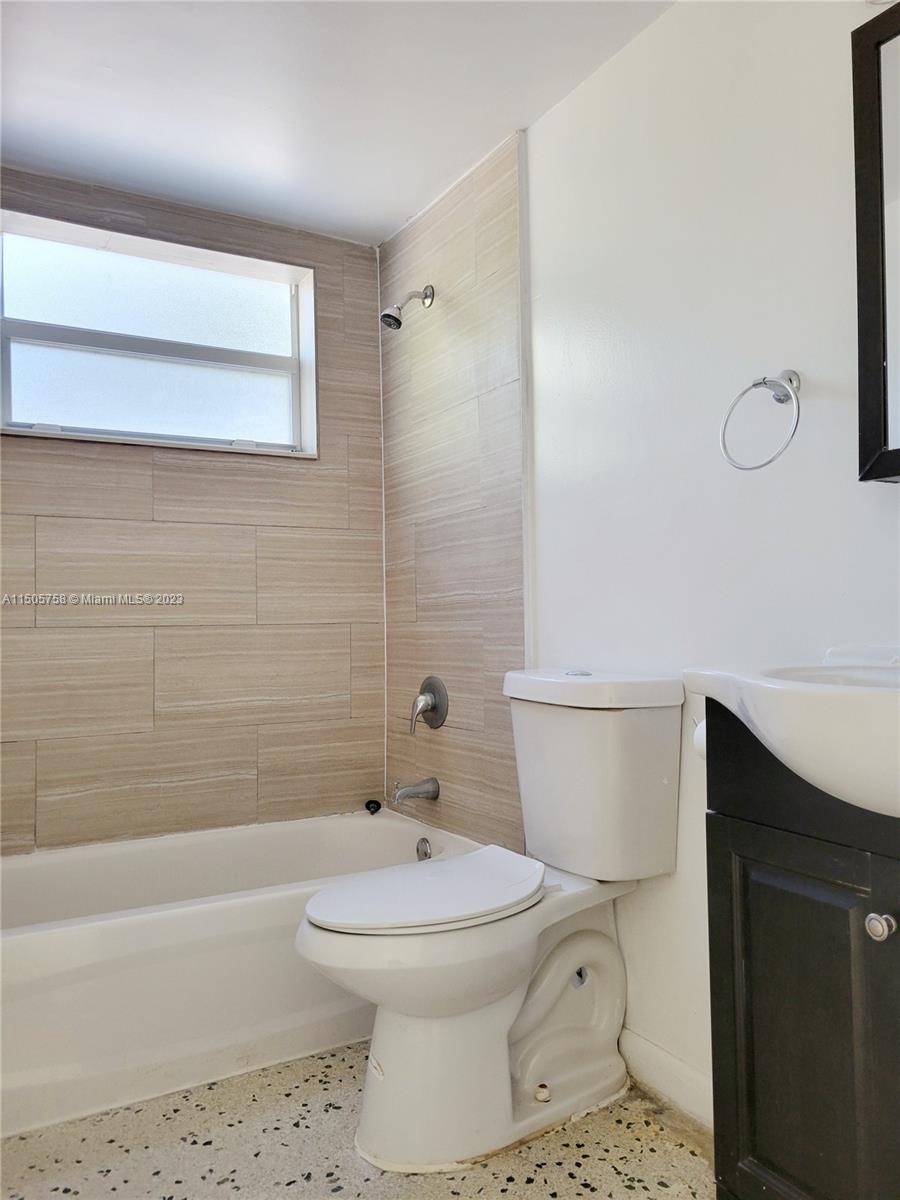 Little River Miami, FL 33138 - Photo 9 of 10 a bathroom with a toilet a sink a mirror and bathtub