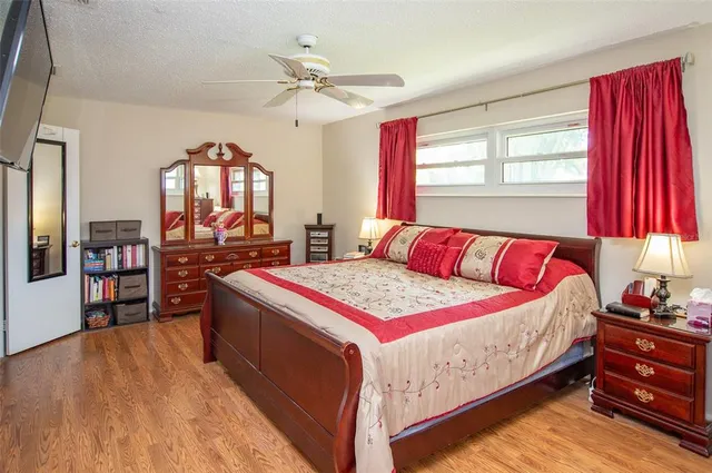 a bedroom with a bed and window