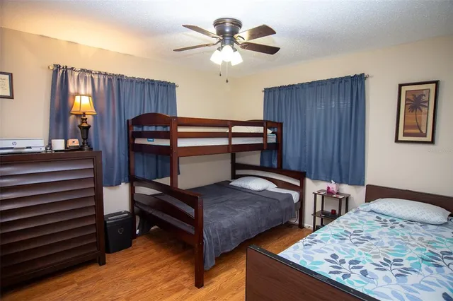 a bedroom with furniture and a chandelier