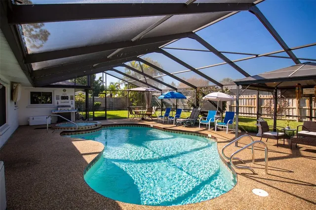 a view of a swimming pool with a patio