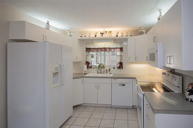 a bathroom with a sink a mirror and a shower