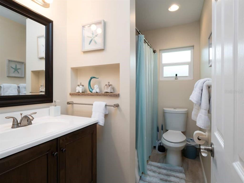 1425 Northeast 13th Street Gainesville, FL 32601 - Photo 11 of 20 a bathroom with a sink and a mirror