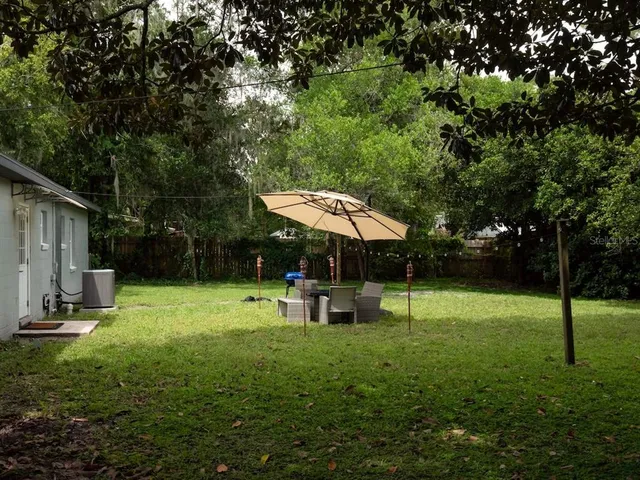 a view of a backyard with a trampoline