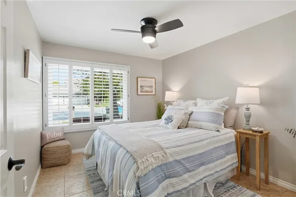 a bedroom with bed and a window