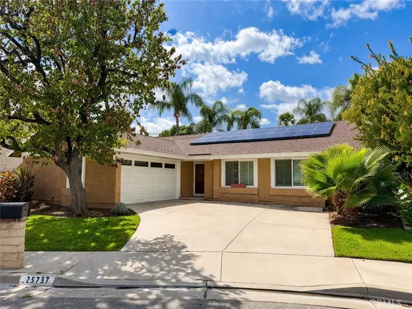 a view of a house with swimming pool and sitting area