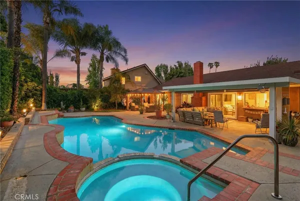 a view of a swimming pool with a patio