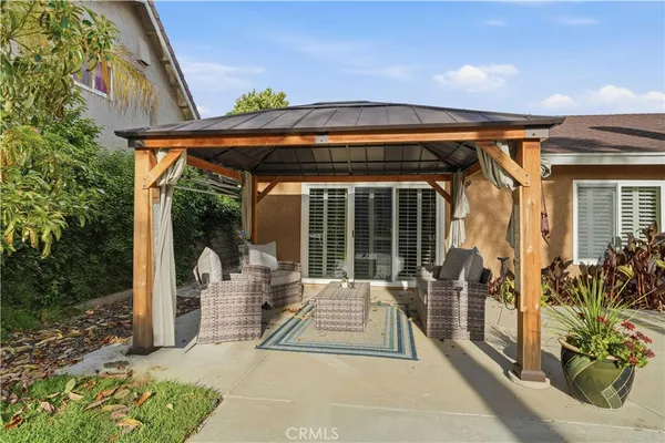 a outdoor living space with patio furniture and garden view