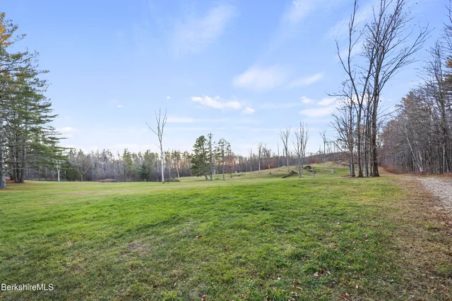 a view of outdoor space with deck and yard