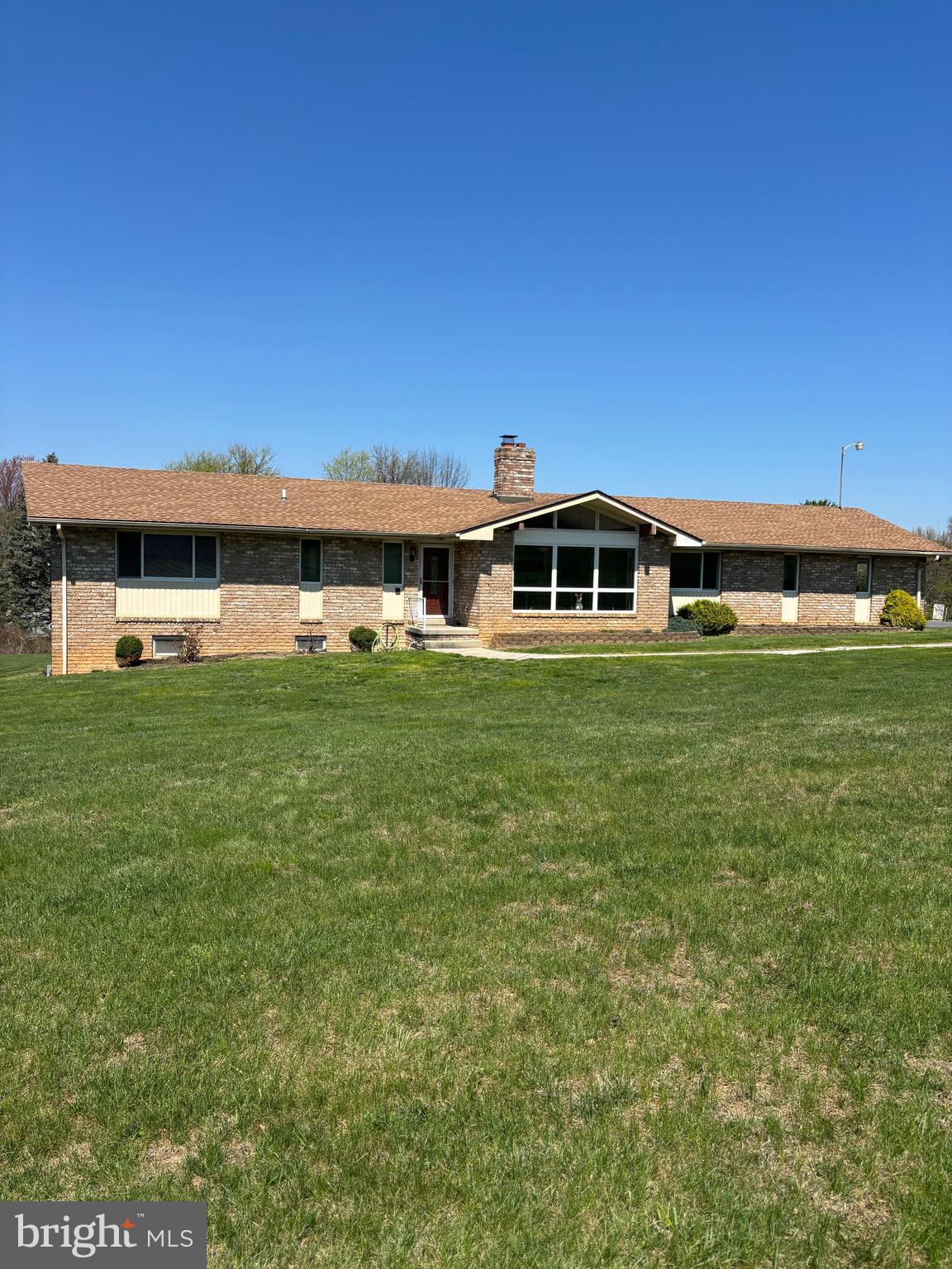 a view of a house with a big yard