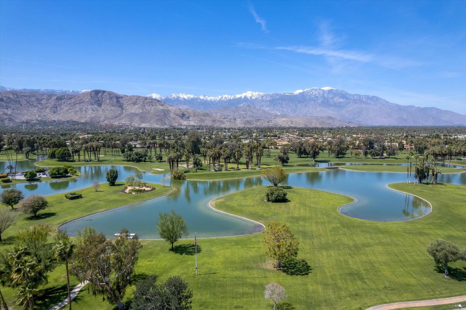 899 Island Drive, Unit 304 Rancho Mirage, CA 92270 - Photo 29 of 30 a view of a lake with a mountain