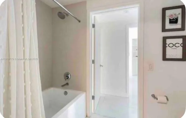 a bedroom with furniture and a baby crib