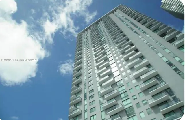 a view of a large building with a city view