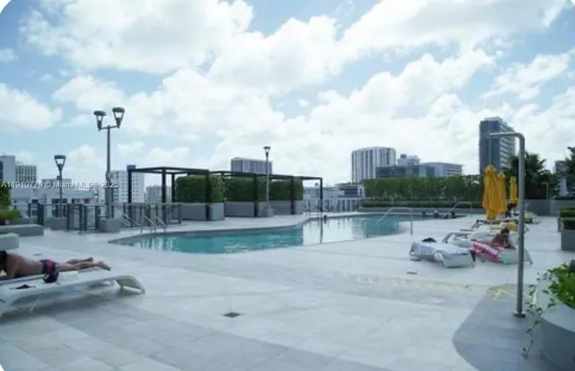 a room with gym equipment and a large window