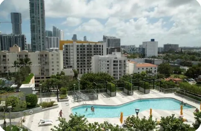 a view of a room with furniture and windows