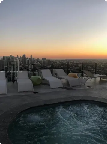 a view of swimming pool with a yard