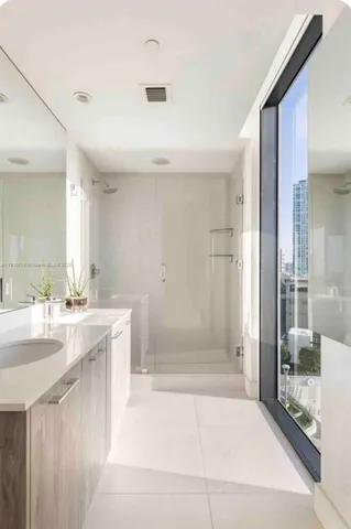 a bathroom with a bathtub and a sink