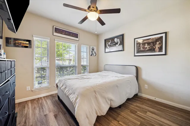 a bedroom with a large bed and a window