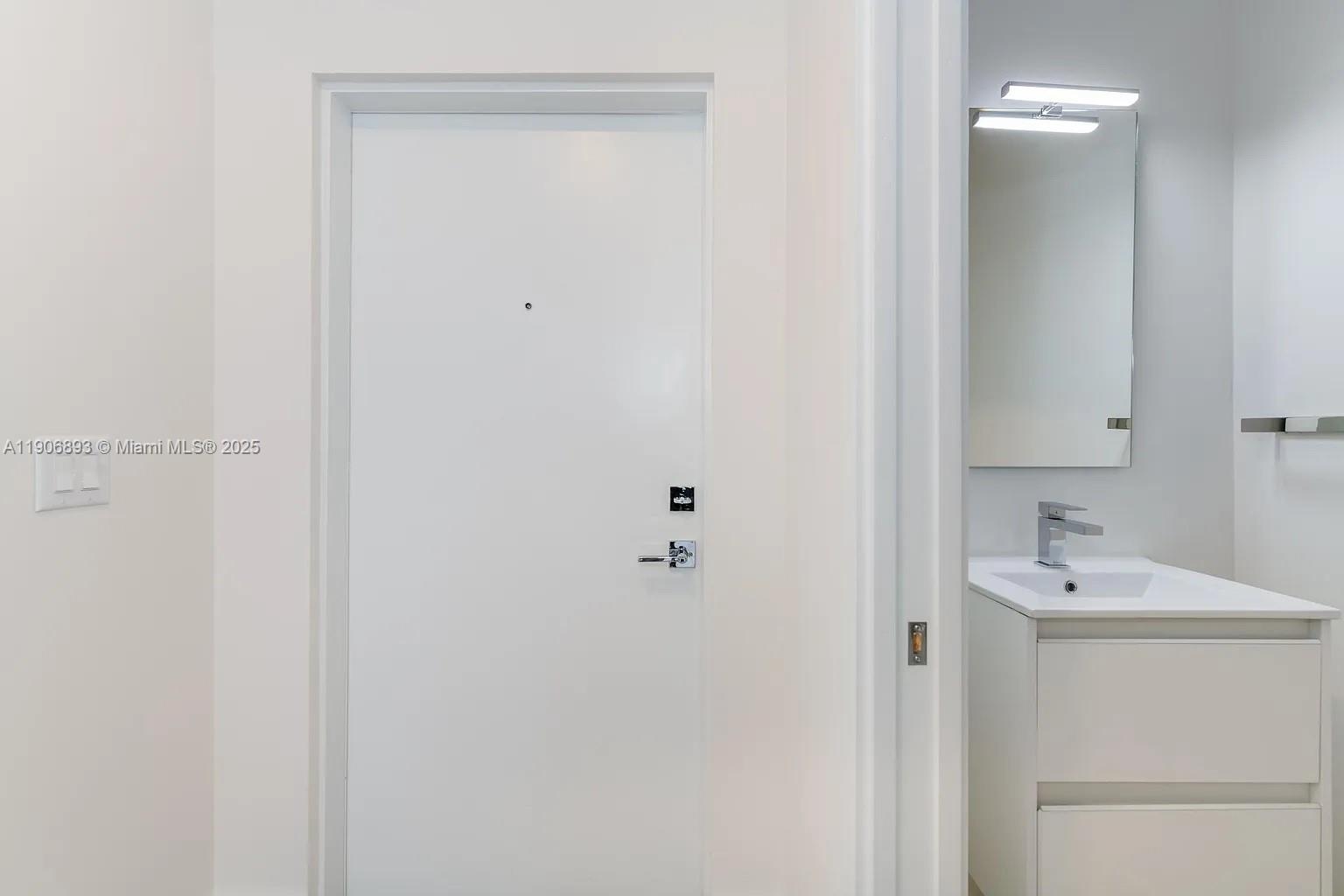 4500 Northwest 8th Place Plantation, FL 33317 - Photo 11 of 31 a bathroom with a sink and a mirror