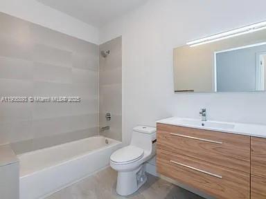 4500 Northwest 8th Place Plantation, FL 33317 - Photo 14 of 31 a bathroom with a toilet a sink and a bathtub