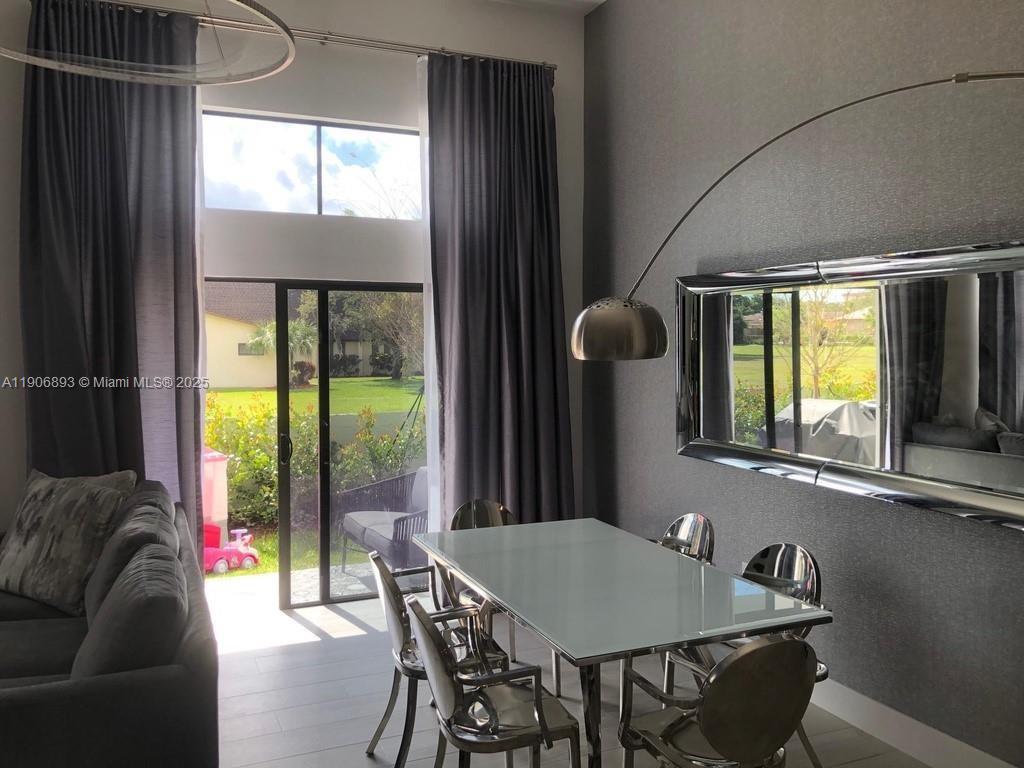4500 Northwest 8th Place Plantation, FL 33317 - Photo 8 of 31 a view of a dining room with furniture and a window