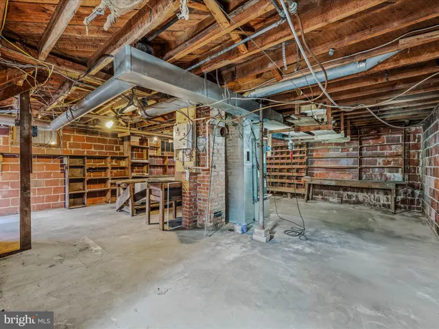 a view of empty room with wooden ceiling