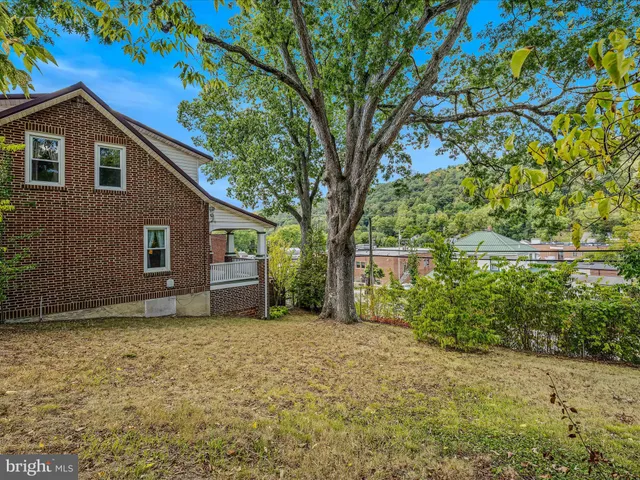 a house with trees in front of it