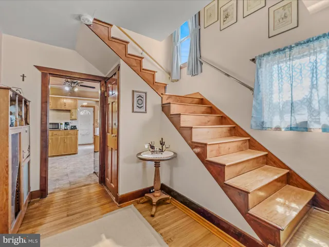a view of staircase with a rug