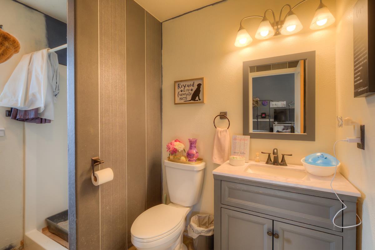 83 Northfork Road Berry Creek, CA 95916 - Photo 37 of 56 a bathroom with a sink vanity mirror and toilet