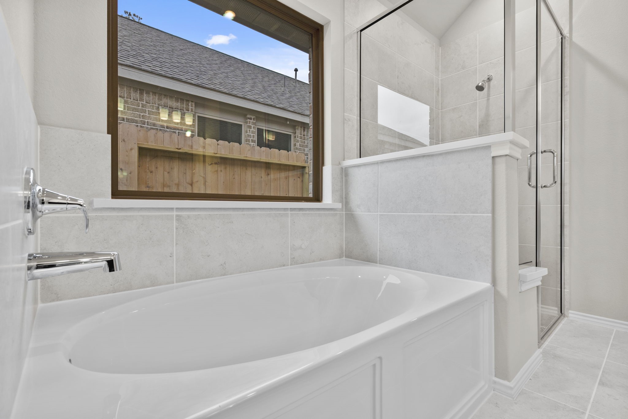 9519 Sierra Crest Lane Porter, TX 77365 - Photo 18 of 35 a white bath tub sitting next to a white cabinet