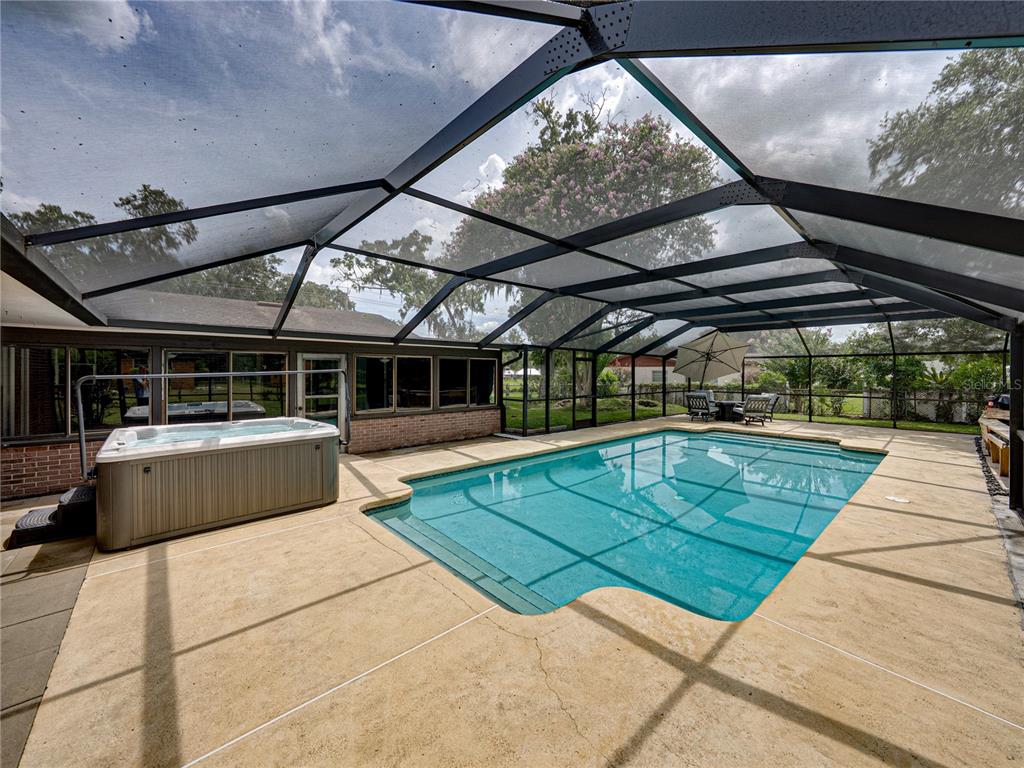 609 West Pipkin Road Lakeland, FL 33813 - Photo 48 of 72 a view of a swimming pool with a patio