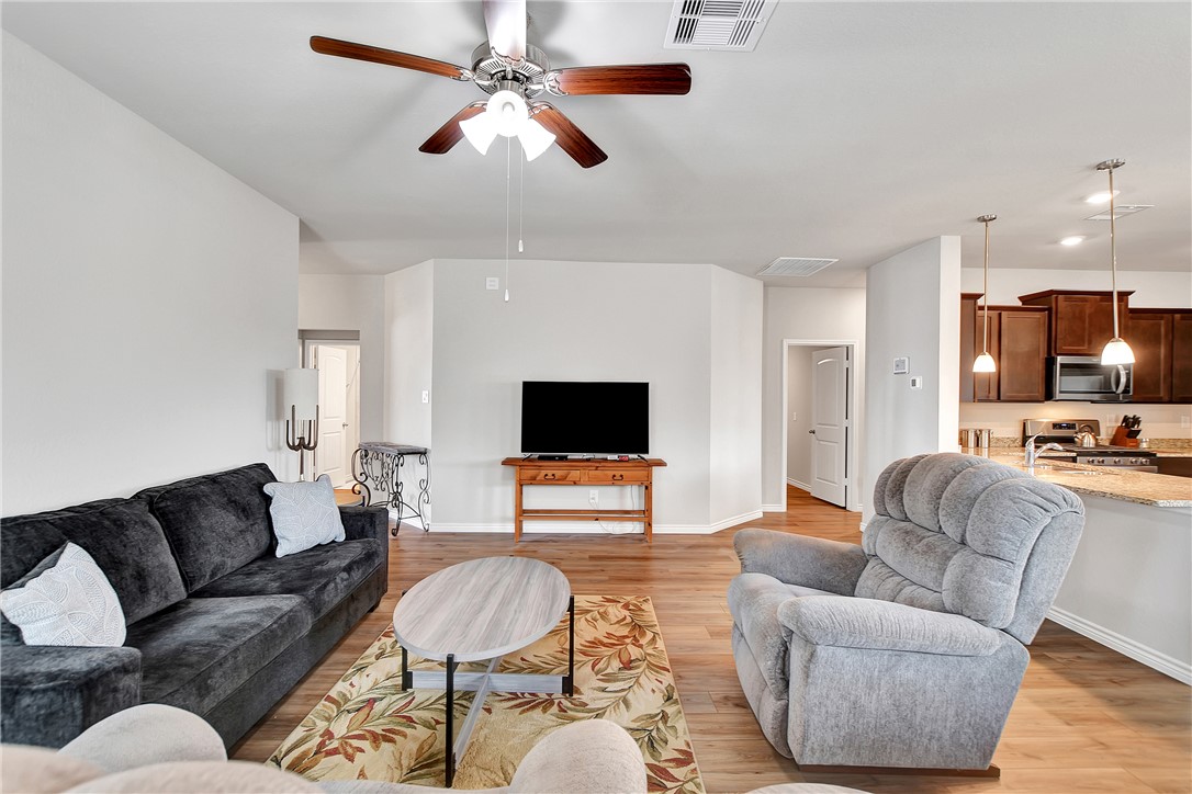 909 Davy Street Brenham, TX 77833 - Photo 9 of 35 Living room featuring a ceiling fan, light wood-type flooring, and recessed lighting