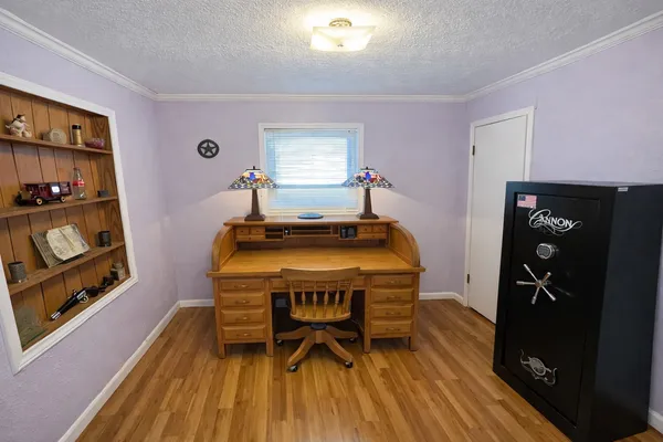 a room with furniture and wooden floor