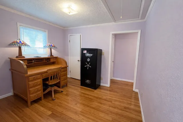 a room with furniture and wooden floor