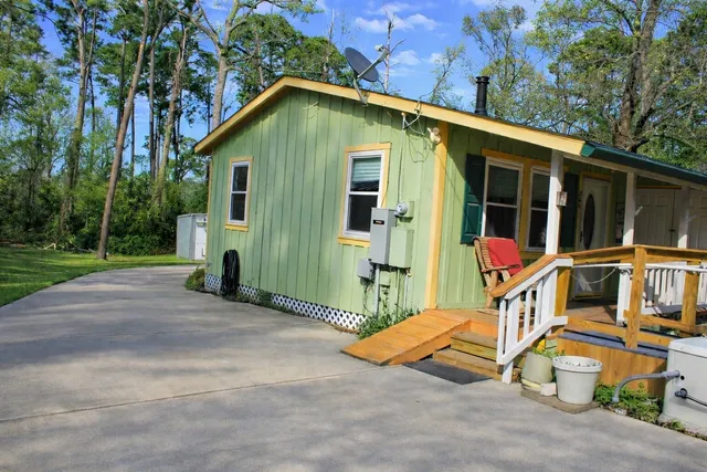a view of backyard with small cabin